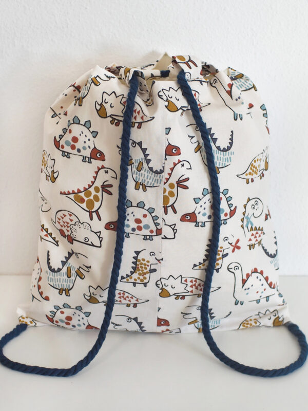 mochila dinos blanco tras 28